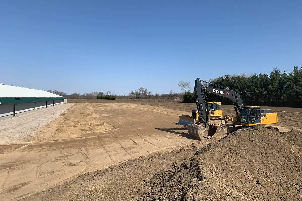 Countryside Excavator and Dozer doing agricultural site grading